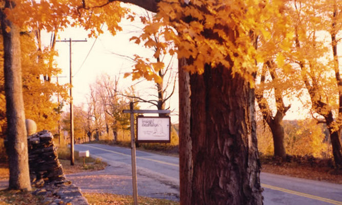 1977 - The original sign amidst fall colors.