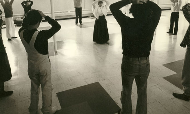 Ruth Denison (center of circle) studied in Burma in the early 1960s and is shown here leading a mindful movement session.