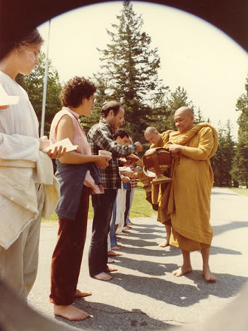 Thai meditation master Ven. Ajahn Chah on alms round at IMS during his 1979 visit.