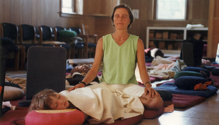 Mother and daughter share a meditative moment.